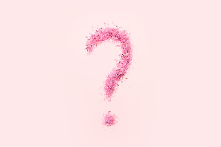 Question mark made of sea salt on pink backgroundの写真素材
