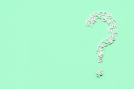 Question mark made of letters on green backgroundの写真素材