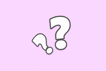 paper question mark on lilac background