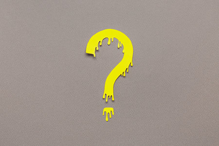 paper question mark on dark backgroundの写真素材