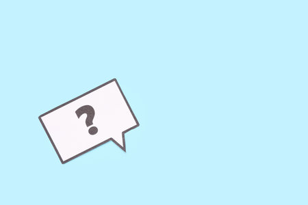 Speech bubble with question mark on blue background