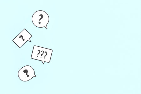 Speech bubbles with question marks on blue background