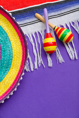 Mexican maracas with sombrero hat and serape on purple backgroundの写真素材