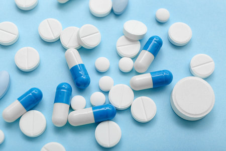 Different pills on blue background, closeupの写真素材