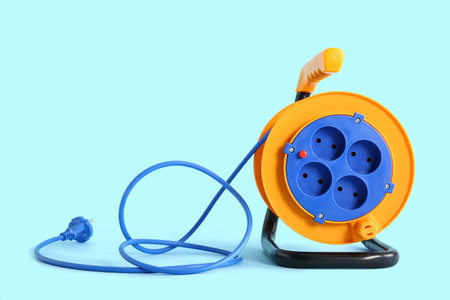Extension electric cable reel on color backgroundの写真素材
