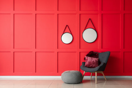 Armchair and mirrors in modern living roomの写真素材