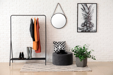Interior of modern hallway with mirror and clothes hangerの写真素材