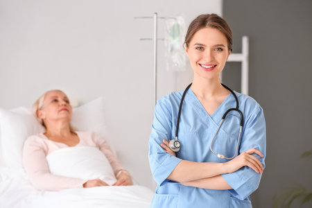 young female doctor in hospital roomの写真素材