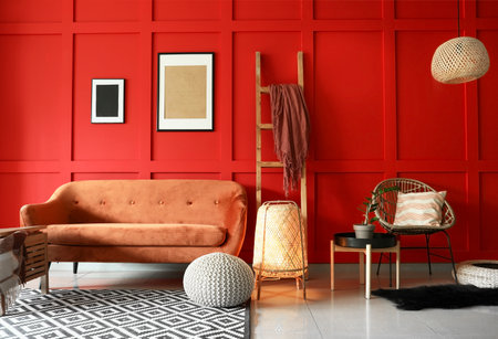 Stylish interior of living room with sofa and lanternの写真素材