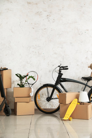 Cardboard boxes with accessories in new flat on moving dayの写真素材
