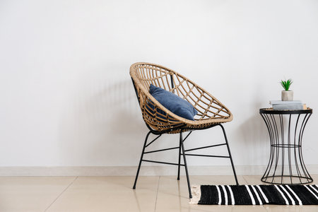 Stylish interior of room with armchair and tableの写真素材