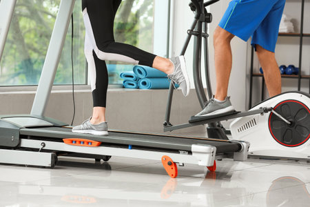Sporty young couple training in gym