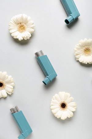 Inhaler with flowers on gray backgroundの写真素材