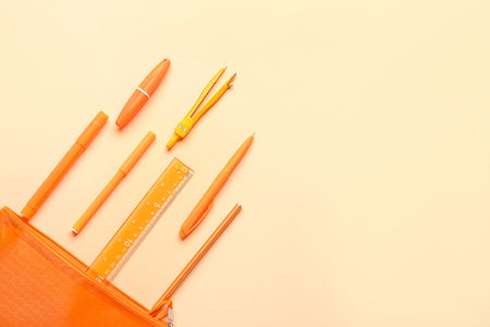 Stationery supplies on beige background