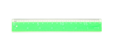 Green plastic ruler on white backgroundの写真素材