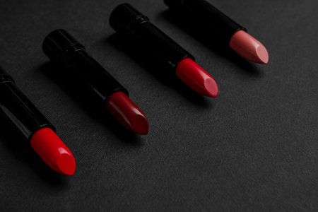 Set of beautiful lipsticks on dark backgroundの写真素材