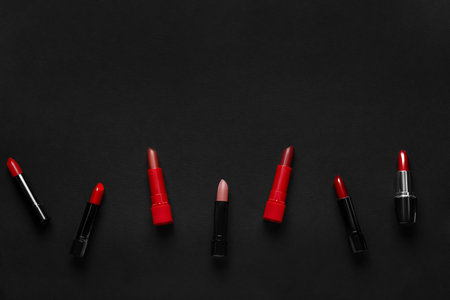 Composition with beautiful lipsticks on dark backgroundの写真素材