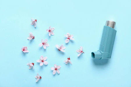 Inhaler with flowers on blue backgroundの写真素材