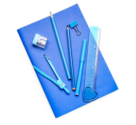 Notebook and stationery supplies on white backgroundの写真素材