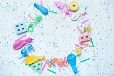 Frame made of baby blocks, balloons and confetti on gray table. Children's Day celebrationの写真素材
