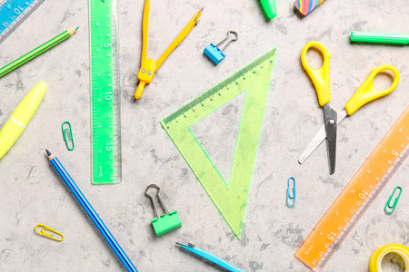 Colorful stationery supplies on grunge background
