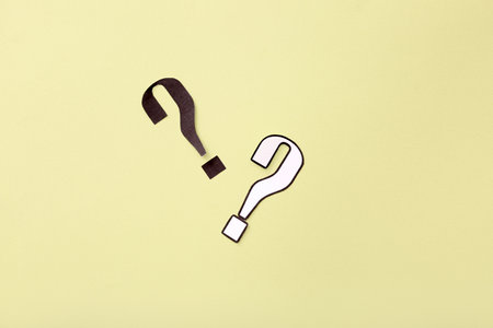 paper question mark on yellow backgroundの写真素材