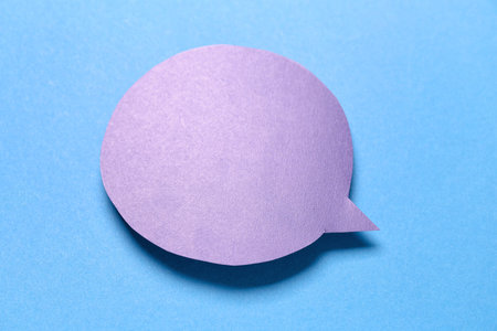 Blank paper speech bubble on blue background