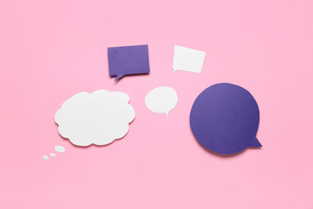 Blank speech bubbles on pink background