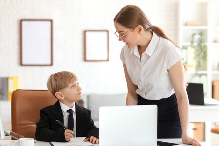Funny little businessman working with secretary in officeの写真素材
