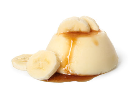 Delicious pudding with bananas covered by caramel syrup isolated on white backgroundの写真素材