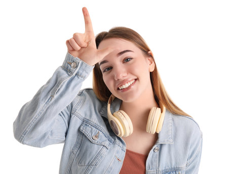 Young woman showing loser gesture on white backgroundの写真素材
