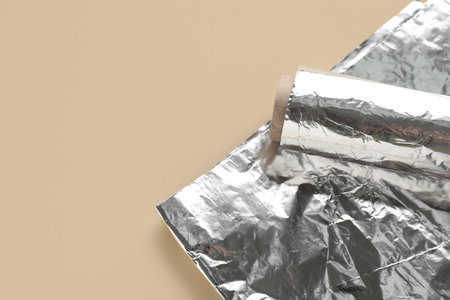 Aluminum foil roll on color backgroundの写真素材