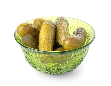 Bowl with tasty fermented cucumbers on white backgroundの写真素材