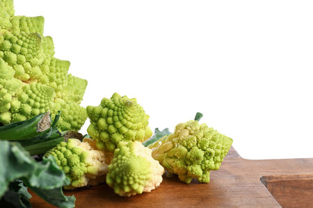 Wooden board with romanesco cabbage on white backgroundの写真素材
