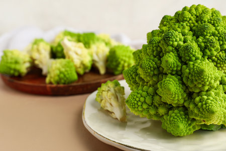 Plate with romanesco cabbage on beige tableの写真素材