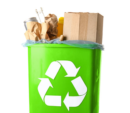 Trash bin with different garbage and recycling symbol isolated on white backgroundの写真素材