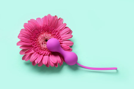 Anal plug with flower on mint background