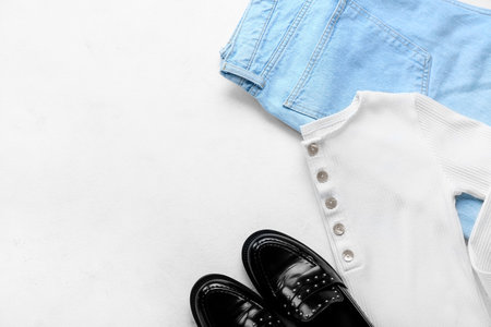 Stylish jeans with shirt and shoes on white backgroundの写真素材