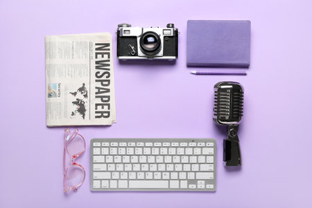 Frame made of journalist's equipment on lilac backgroundの写真素材