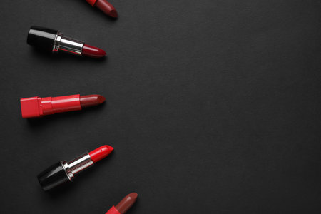 Composition with beautiful lipsticks on dark backgroundの写真素材