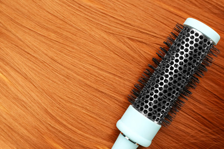 Brush on red hair, closeupの写真素材