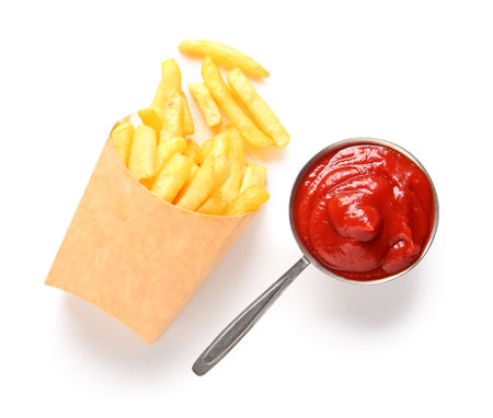 Paper box with tasty french fries and ketchup isolated on white backgroundの写真素材
