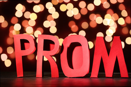 Word PROM on dark table against blurred lightsの写真素材