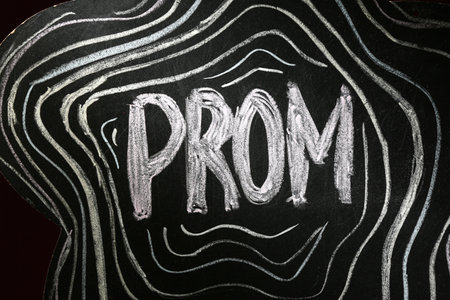 Chalkboard with word PROM on dark background, closeupの写真素材