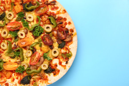 Vegetable pizza on blue backgroundの写真素材