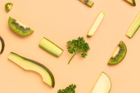 Frame made of fresh fruits and vegetables on orange backgroundの写真素材