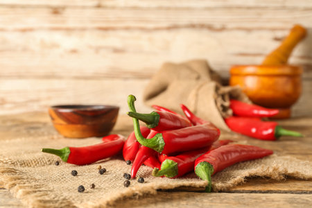 Heap of fresh chili peppers on tableの写真素材