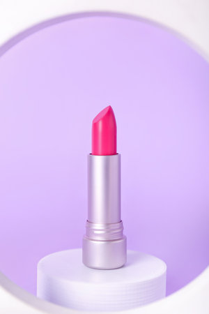 Decorative plaster podiums and lipstick on lilac backgroundの写真素材