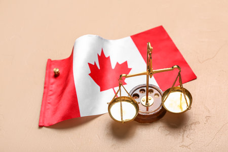 Flag of Canada with justice scales on beige backgroundの写真素材