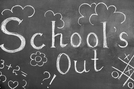 Text SCHOOL'S OUT with drawings on blackboardの写真素材